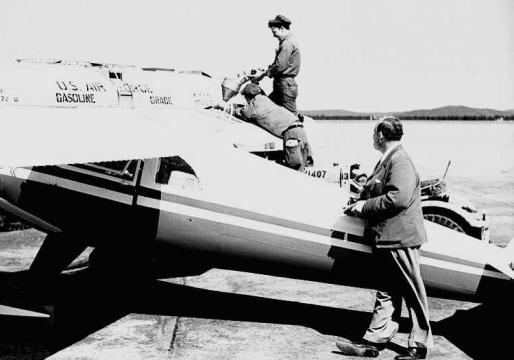Peter Gluckmann supervises the fuelling of Luscombe N1838B at Goose Bay. He had added two extra 30 gallon wing tanks for a total capacity of 90 gallons which gave him about 15 hours of flight time. Photo: Fritz Adam 