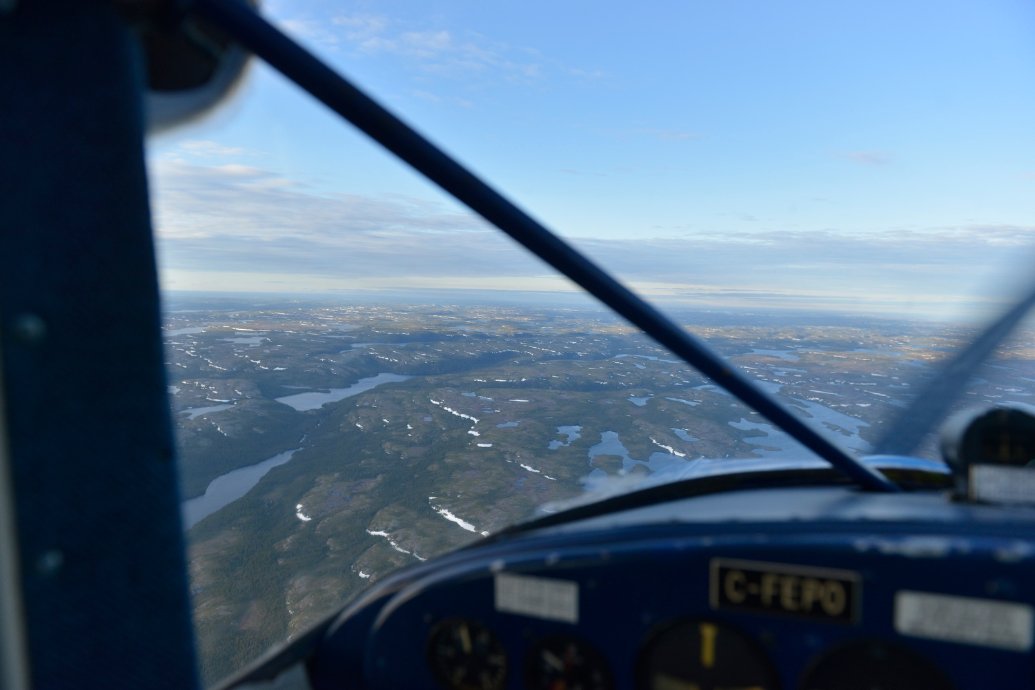 Luscombe 8F C-FEPO (formerly N1838B) Cote Nord/North Shore, Quebec. Flying over rocky taiga terrain. 2017 