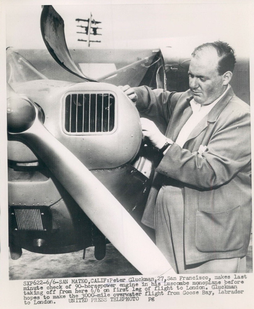 Peter Gluckmann making last minute checks to his 90 horsepower engine before departing San Mateo, CA on June 6, 1953 