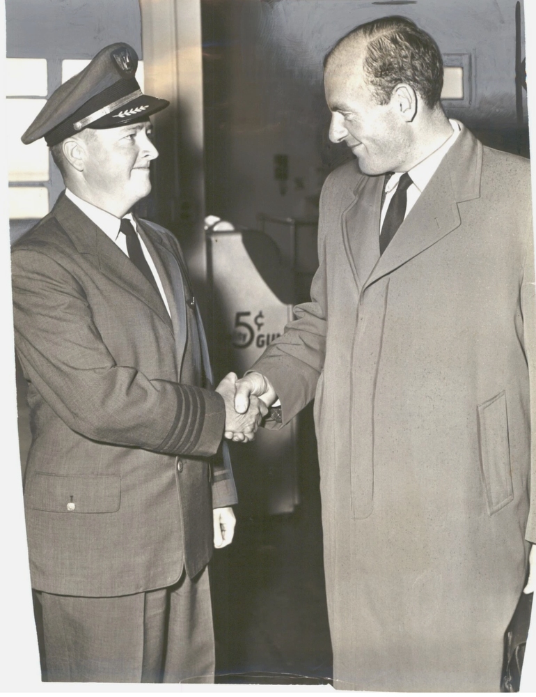 Press clipping from San Francisco Examiner. May 12, 1958? THANKS FOR THE HOP - Peter Gluckmann thanks United Air Lines pilot Neal Daniels for the “assist” on the San Francisco leg of a 25,000 mile hop. Gluckmann, on the home lap after a solo flight to Africa and Europe, was forced to take a commercial liner in Reno. 
